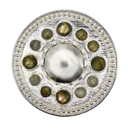 Decorative silver circular belt buckle featuring Labradorite gemstones.