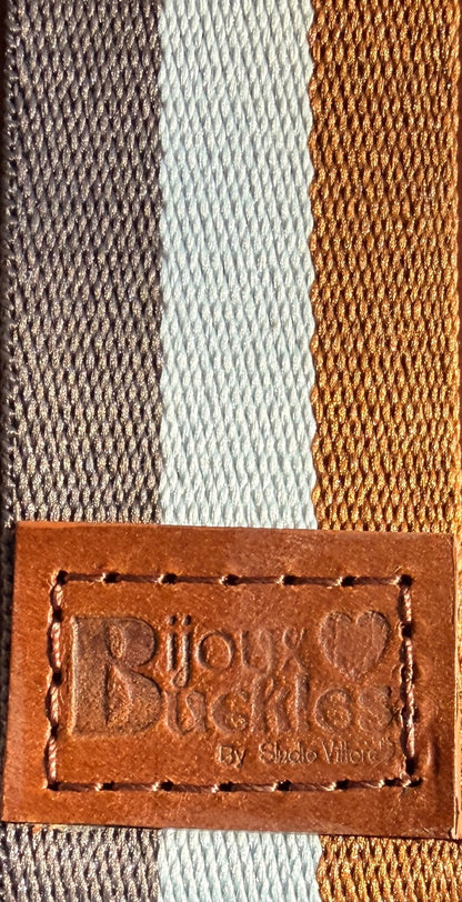 Close-up of a striped strap with a 'Bijoux Buckles' label